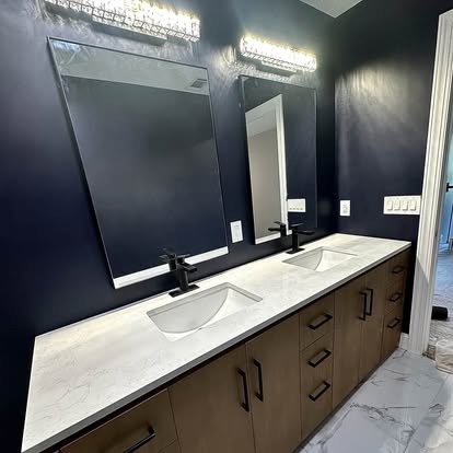 Completed bathroom vanity and tiled shower